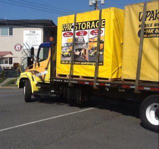 Loading Services. Upak moving truck, photo